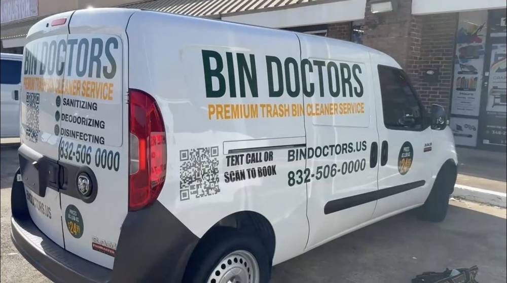 The Bin Doctors van parked at a customer's curb